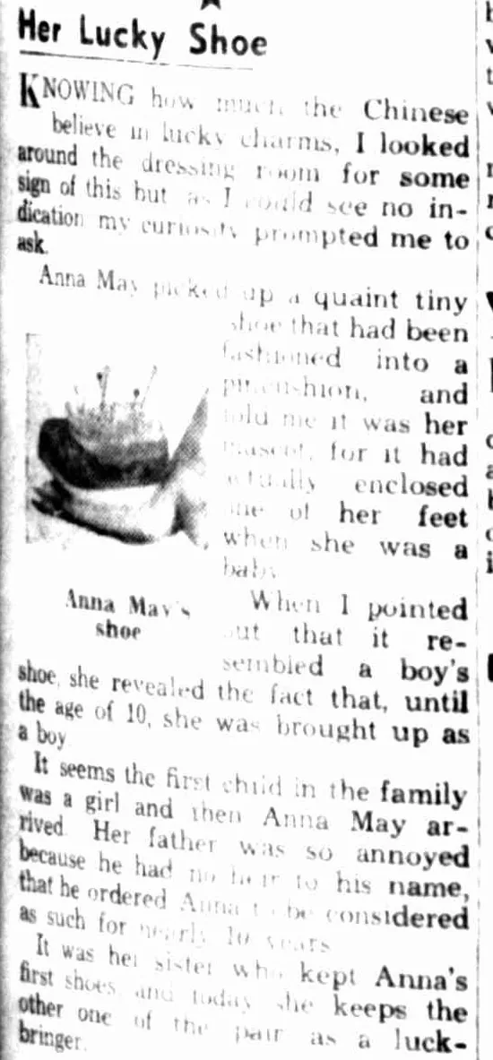 A newspaper column headed Her Lucky Shoe, with a small photograph of a tiny shoe made into a pincushion, captioned Anna May's shoe.